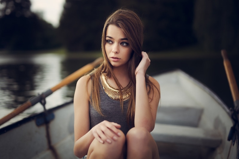 boat, beauty, railing, fashion, front view, one person, straight hair, looking at camera, young adult, Maxime Prokaz, sitting, face, lifestyles, women outdoors