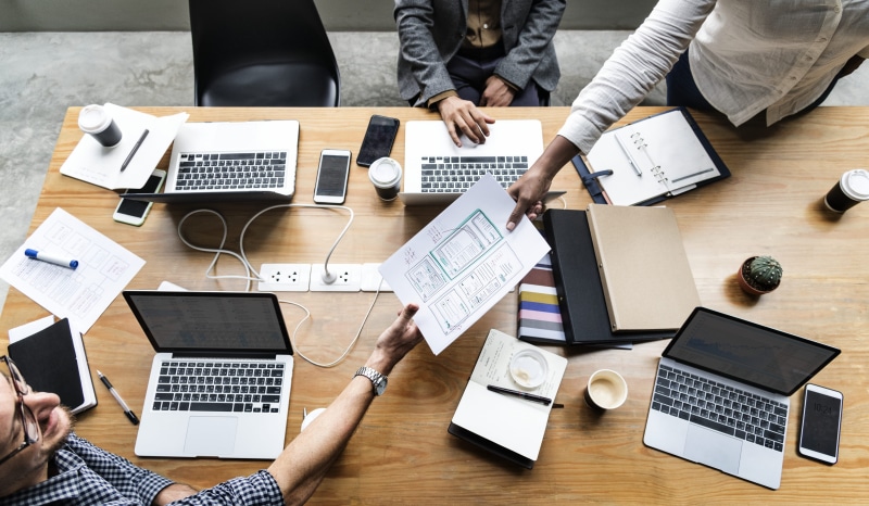 several, men, brown, furniture, connection, notepad, mobile phone, typing, business, wooden, indoors, near, web design, headphones, coffee, holding, computers