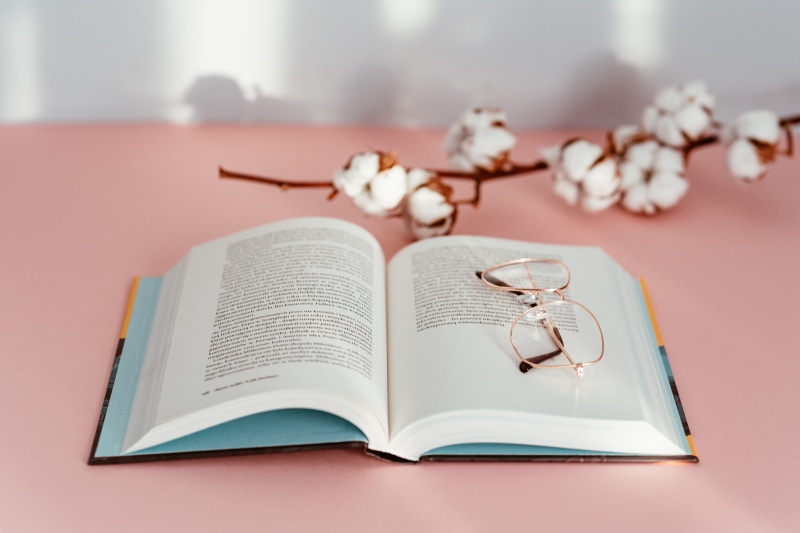 selective focus, book, wisdom, page, close-up, 5K, feminine, still life, paper, pink backgound, focus on foreground, flowering plant, flower, education