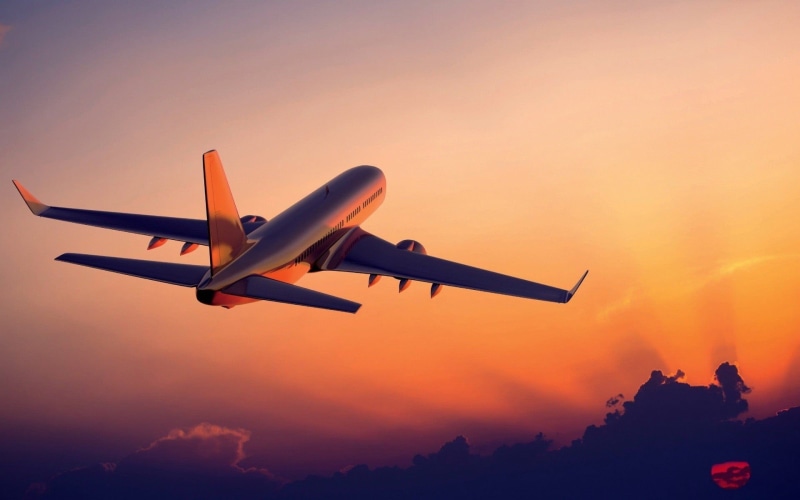 sky, passenger, flying, transportation, airplane, commercial airplane, aircraft, outdoors, dusk, mode of transportation, dramatic sky, orange color, nature