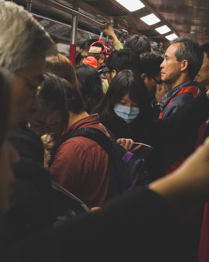 large group of people, public transportation, crowd, rear view, rail transportation, women, togetherness, waiting, real people, indoors, mtr, travel, group of people