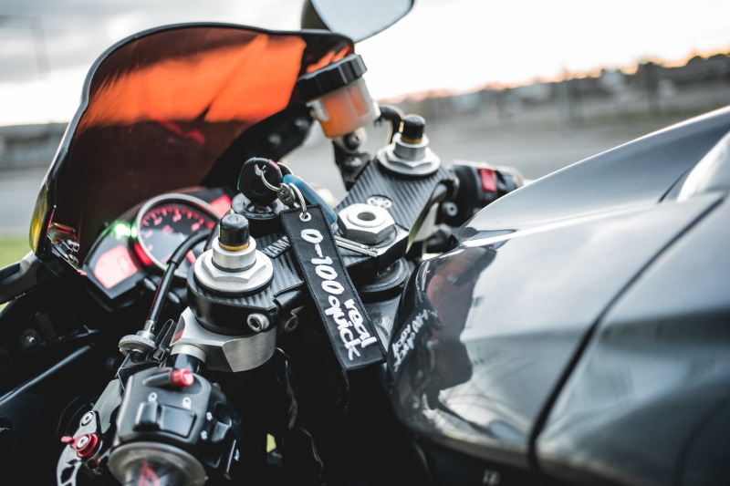 tire, driving, speed, drive, dash, wheel, keyring, bike, land vehicle, transportation, car, outdoors, handlebars, sports race, road, dashboard, motorsport