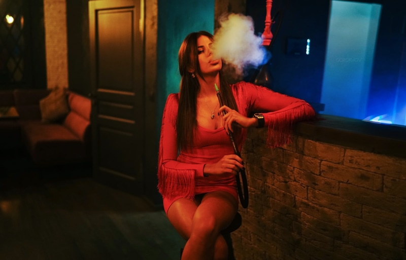 indoors, clothing, real people, bad habit, Hookah, front view, red dress, social issues, shisha, smoke, night, hairstyle, long hair, casual clothing, young adult