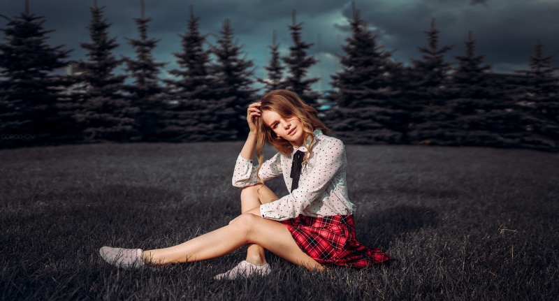 model, full length, young adult, plant, one person, looking at viewer, sitting, nature, forest, outdoors, fashion, hair, young women, beauty, shirt, portrait