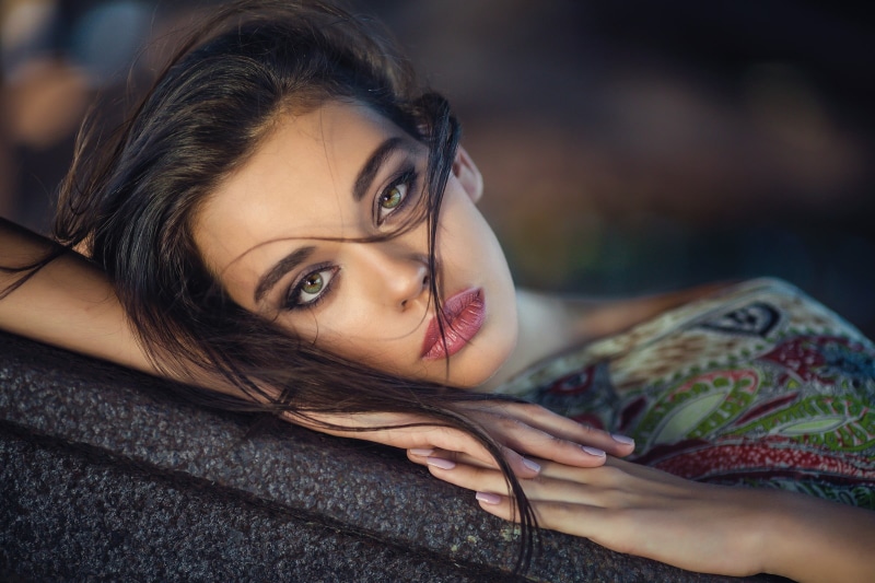 hairstyle, fashion, looking at camera, smoky eyes, focus on foreground, depth of field, young adult, 1080P, portrait, beautiful woman, adult, smiling
