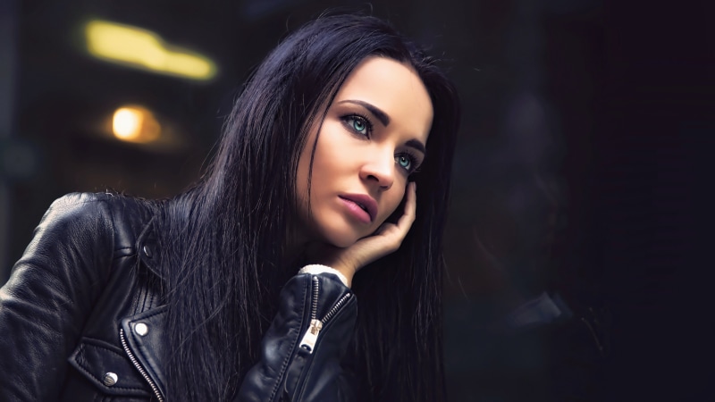 front view, lifestyles, fashion, clothing, focus on foreground, leather jackets, long hair, model, leather, looking at camera, young adult, hairstyle, headshot
