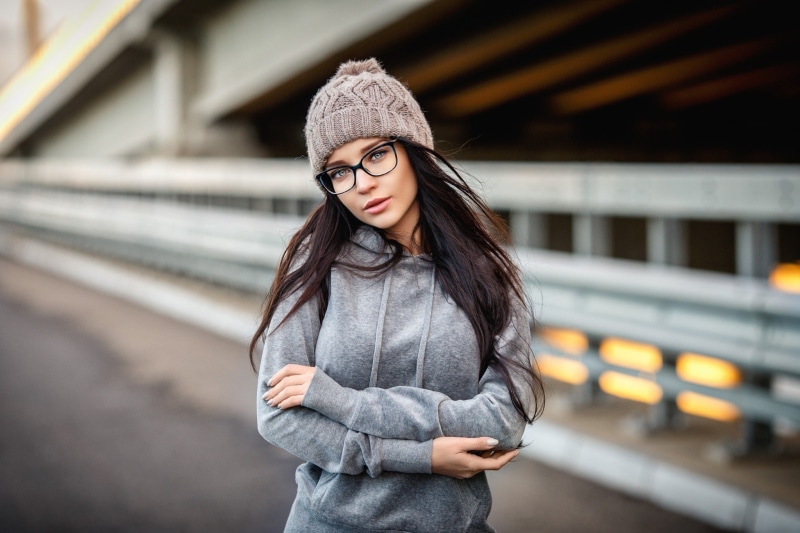 train, outdoors, hair, architecture, women, brunette, rail transportation, young adult, beauty, track, one person, portrait, hat, adult, clothing, beautiful woman