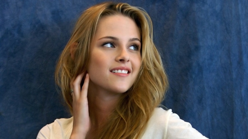 cheerful, one person, hairstyle, emotion, blue background, celebrity, Kristen Stewart, hair, young adult, beauty, human hair, headshot, happiness, indoors