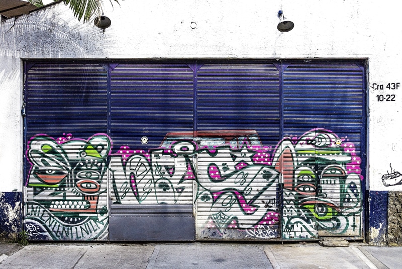 medellin, urban, creativity, building exterior, street art, purple, closed, graffiti, text, mural, art, sidewalk, outdoors, painted, built structure, multi colored