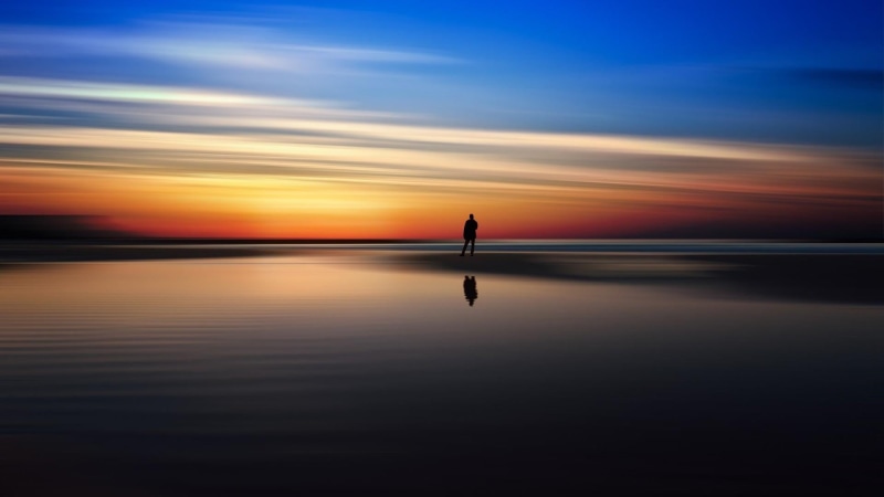 reflection, nature, long exposure, orange color, beauty in nature, man, horizon, sky, calm, idyllic, horizon over water, sunset, evening, afterglow, silhouette