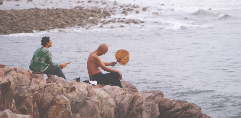 4K, person, two, beauty in nature, rock, adult, woman, beside, beach, leisure activity, asian, nature, facing, old man, body, rock - object, sitting, ocean