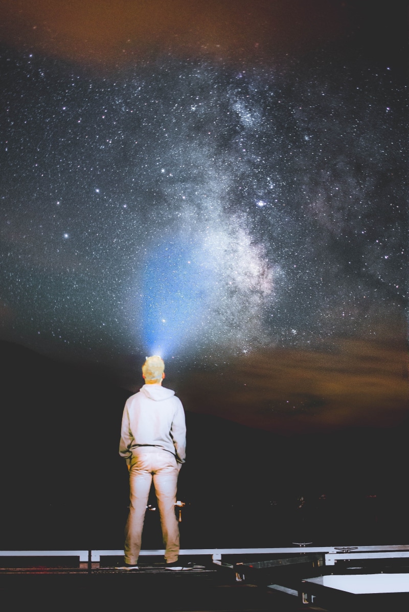 flashlight, one man only, leisure activity, painting, casual clothing, sky, star - space, astronomy, night, rear view, looking, only men, standing, way