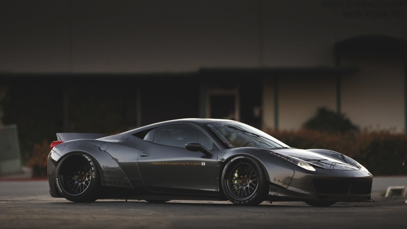 luxury, focus on foreground, chrome, outdoors, mode of transportation, shiny, built structure, transportation, no people, architecture, black, tire, night