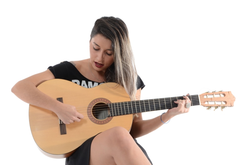 musical Instrument, playing, woman, rock, people, music, guitar, pop, beautiful, one Person, beige, sing, looking down, females, shirt, women, black, hairstyle