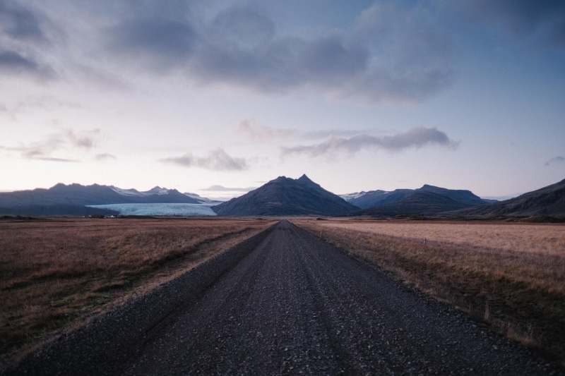cloud, mountain range, sunset, 5K, highway, landscape, outdoors, south iceland, perspective, glacier, dirt, mountainous, travel, roadtrip, remote