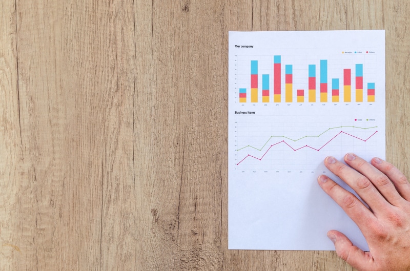 success, blank, stats, workplace, white, document, space, person, above, empty, chart, finance, bar graph, 5K, adult, investment, indoors, wood, human body part