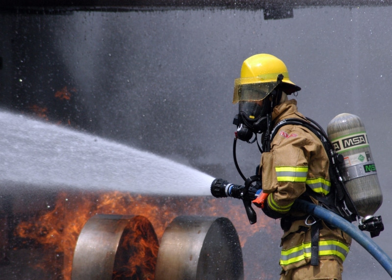 water, uniform, simulated plane fire, clothing, training, sport, work helmet, spraying, people, rescue worker, protection, emergency services occupation