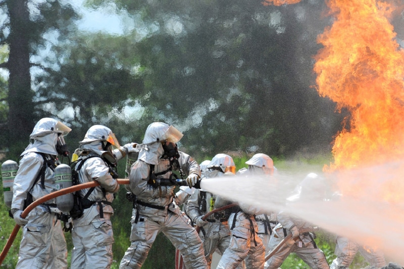 outdoors, heat, tree, waves, smoke - physical structure, real people, government, training, service, fire, people, occupation, men, live, job, firefighters