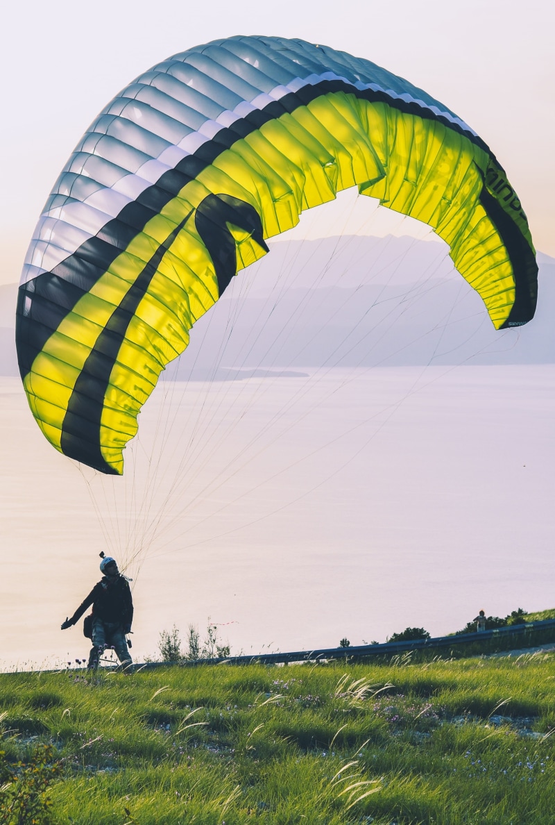 landscape, 4K, highland, leisure activity, outdoors, pulling, ground, person, freedom, full length, flying, outdoor, rear view, grass, real people, air