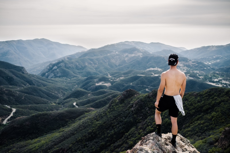 black, scenery, mountain peak, scenics - nature, person, peak, rear view, man, wearing, hills, mountain, day, tranquil scene, at the edge of, nature, real people