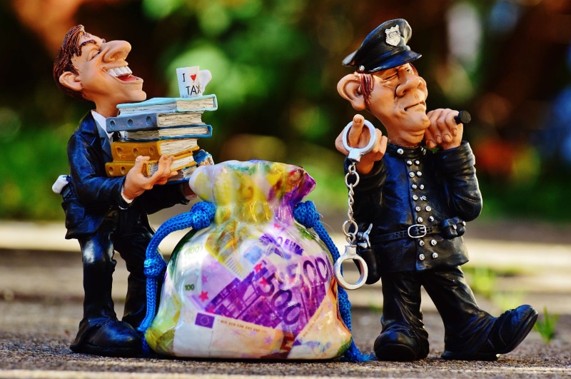 innocence, representation, tax evasion, police, wealth, billing, child, people, law, scam, costume, taxes, handcuffs, offspring, toy, corruption, tax return