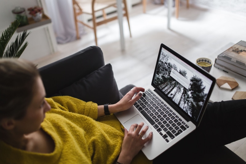 coffee table, home Interior, females, home, computer, using Laptop, at home, working At Home, macbook pro, adult, young, caucasian Ethnicity, one Person