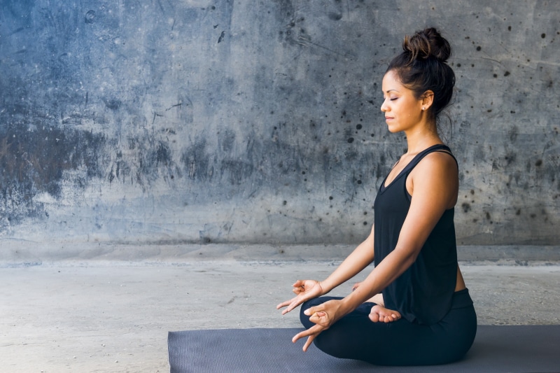 legs crossed, tank top, tanned, sitting, hairbun, women, meditation, 2K, profile, black clothing, yoga pants, barefoot, brunette