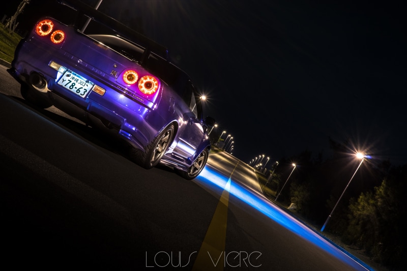 5K, outdoors, Nissan Skyline GT-R R34, city, blurred motion, car, mode of transportation, light trail, road, transportation, illuminated, no people, speed