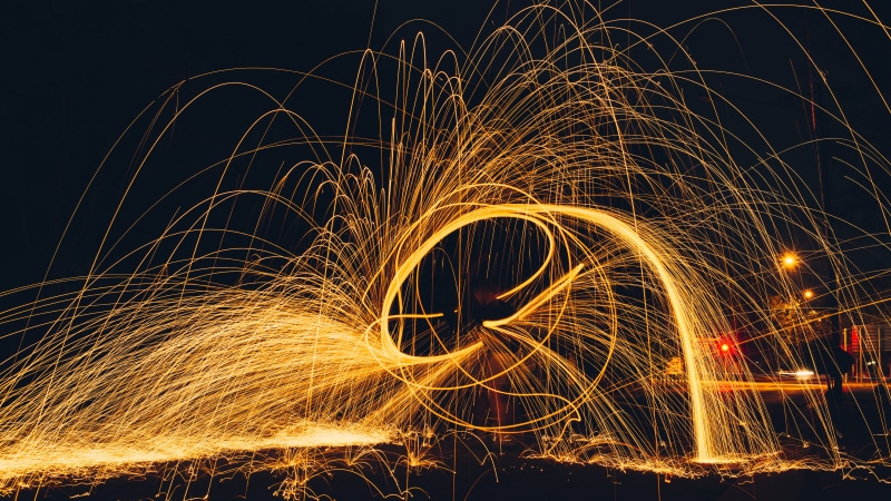 orange color, dark, fire, illuminated, festival, dancing, motion, sparks, color, water, fireworks, wire wool, light - natural phenomenon, evening, blurred motion