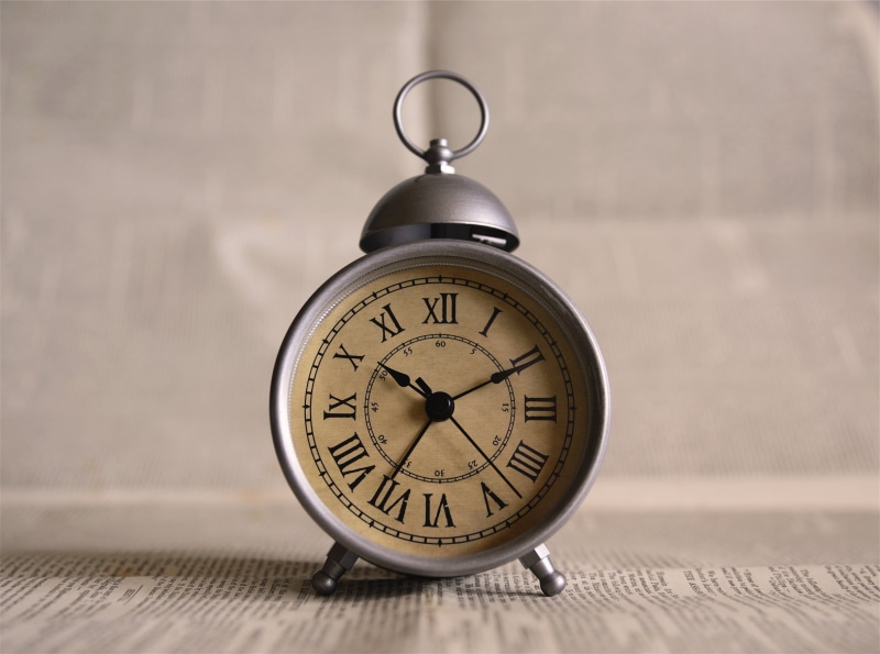 focus, old-fashioned, clock, analog, single object, shape, clock face, gray, table, metal, indoors, focus on foreground, day, selective, still life, hour hand