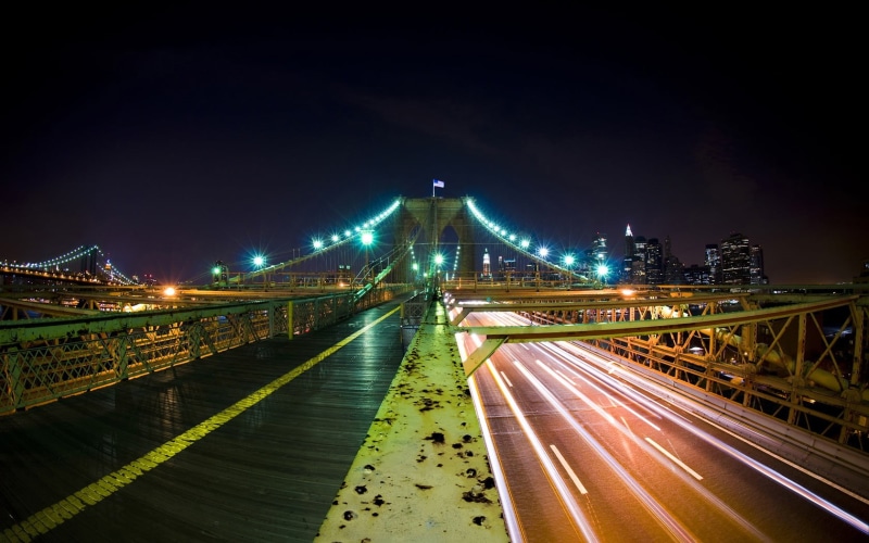 illuminated, transportation, wet, building, night, time, sky, traffic, bridge, bridge - man made structure, speed, lights, light trails, road, outdoors