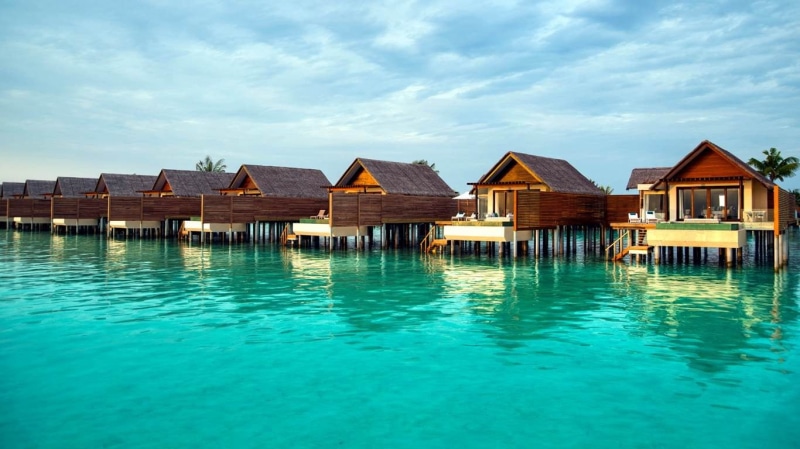 stilt house, sky, building exterior, tranquil scene, building, Maldives, tranquility, brown, turquoise colored, house, nature, sea, wooden, tropical, architecture