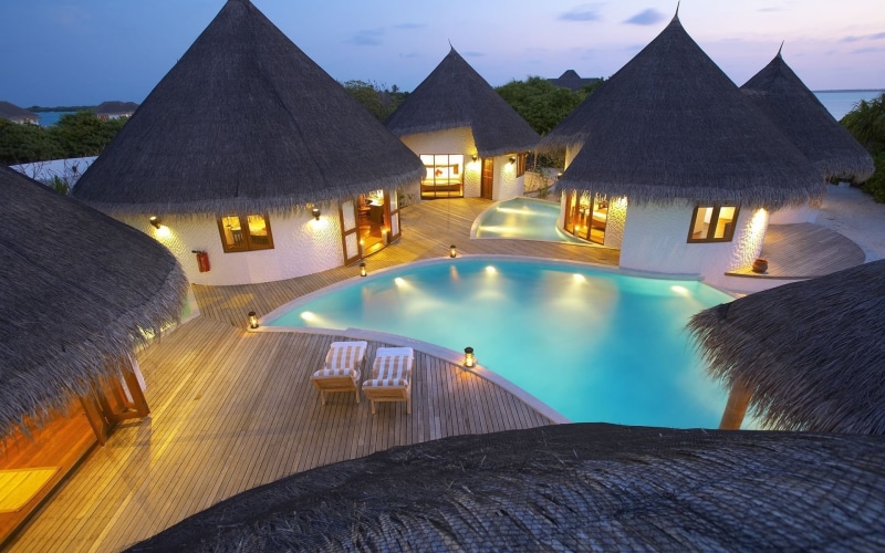 hotel, mountain, night, no people, illuminated, built structure, thatched roof, dusk, roof, outdoors, beauty in nature, 1080P, water, nature, luxury, wood - material