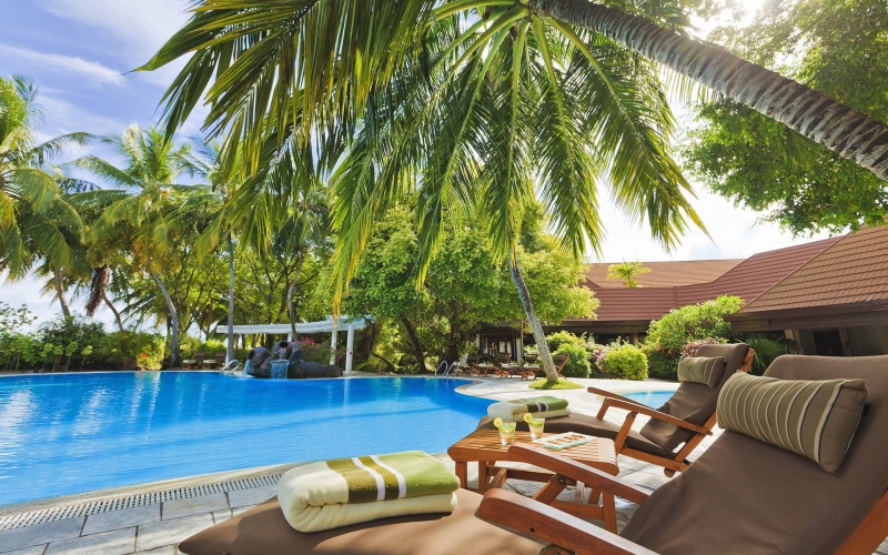 tourist resort, day, sunlight, luxury, plant, architecture, travel destinations, wealth, lounge chair, outdoors, tree, pool, poolside, water, nature, seat