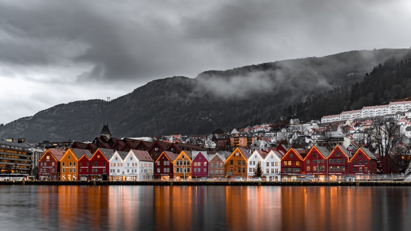 reflection, building exterior, panorama, roof, mountain, norway, mountain range, bryggen, building, water, cloud - sky, countryside, neighborhood, winter