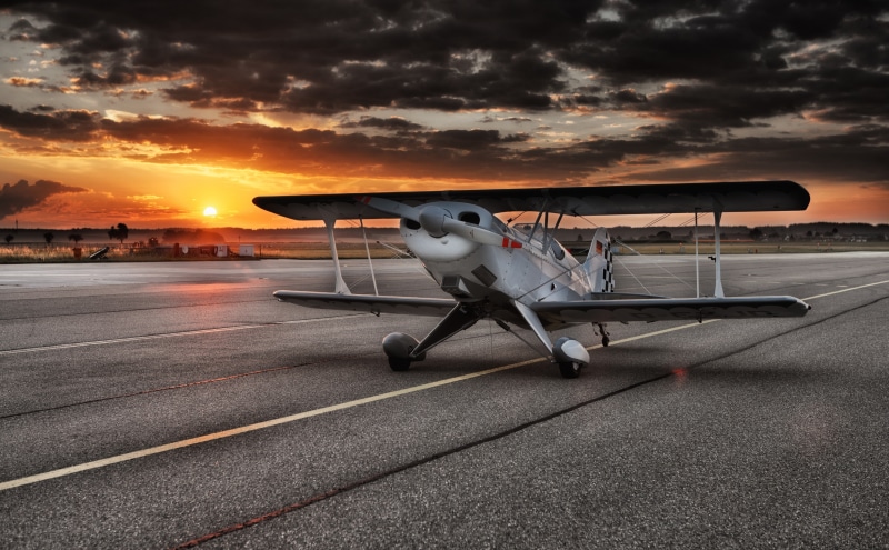 Orange, Army, airport runway, propeller plane, outdoors, Aircraft, Airport, no people, sky, dramatic sky, mode of transportation, passenger boarding bridge