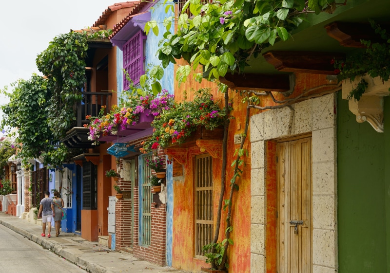 low angle view, flower, no people, window, plant, nature, growth, town, outdoors, city, jar, pedestrian, village, balcony, colombia, urban, multi colored