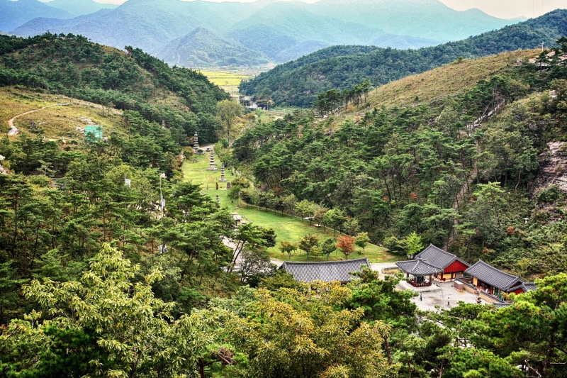 landscape, mountain range, green color, travel, built structure, tranquility, temple, 4K, plant, non-urban scene, day, building exterior, house, building