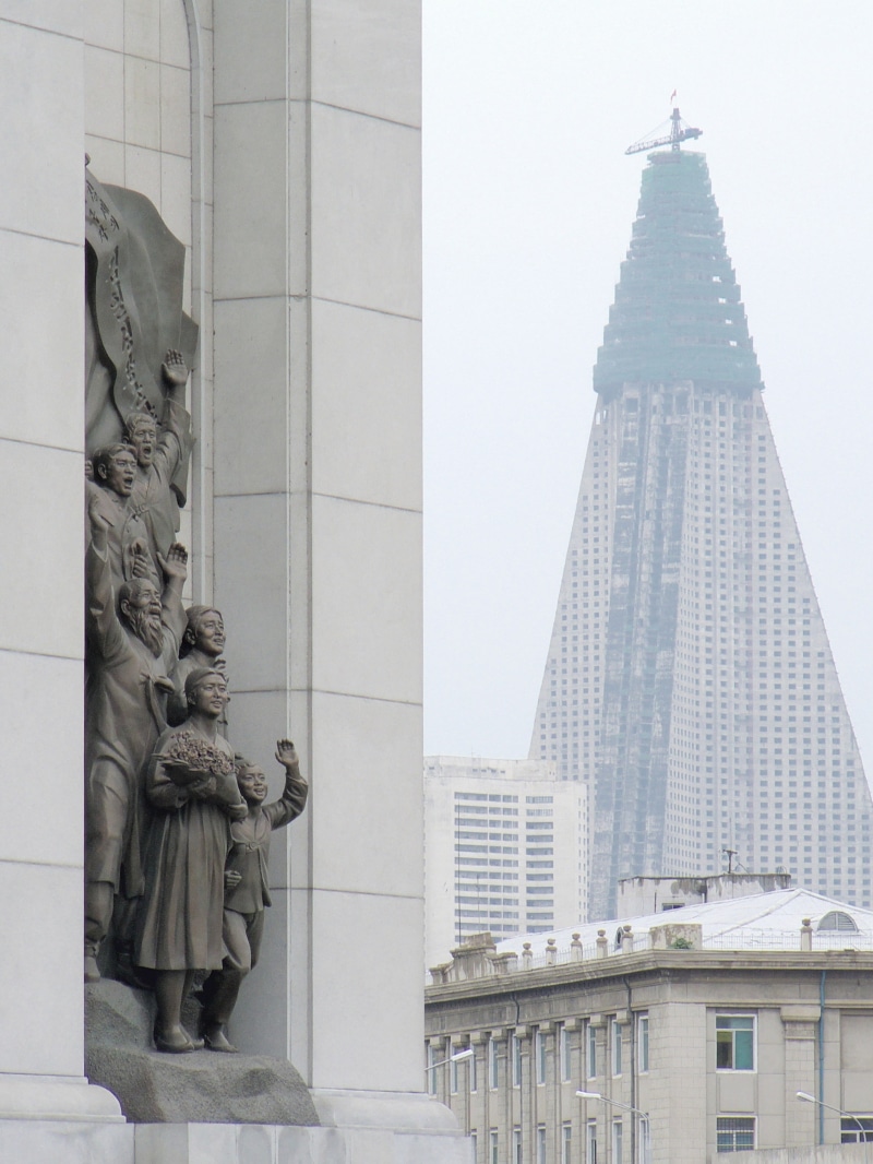 built structure, building exterior, skyscraper, human representation, DPRK, sculpture, representation, office building exterior, no people, low angle view