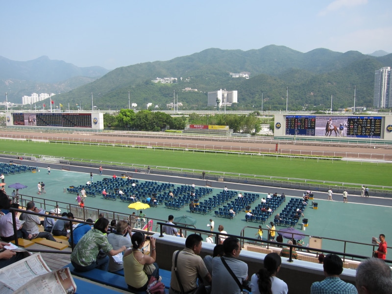 large group of people, outdoors, thoroughbred Horse, hong kong, leisure activity, competitive Sport, horse races, racehorse, built structure, architecture
