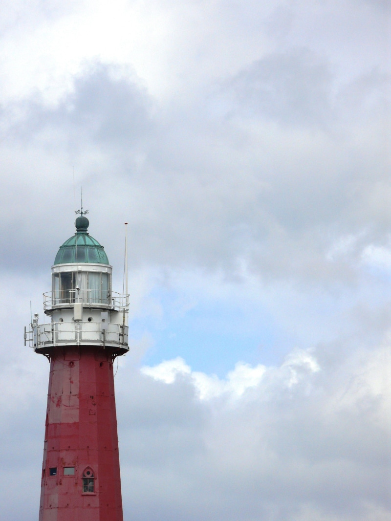 building exterior, Air, Lighthouse, sky, cloud cover, outdoors, protection, direction, day, sea, green, building, safety, water, 2K, cloud - sky, nature