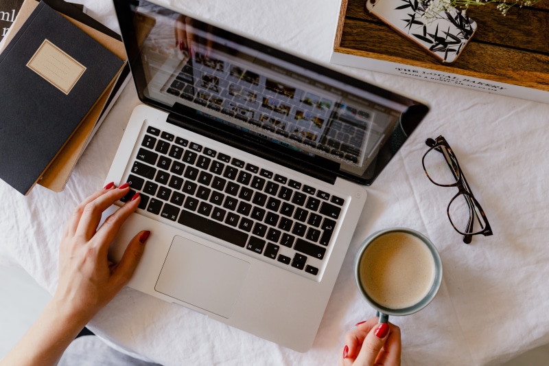 high angle view, study, food and drink, human hand, desk, office, hand, macbook, working, furniture, cappucino, cup, drink, table, adult, woman, mug, computer