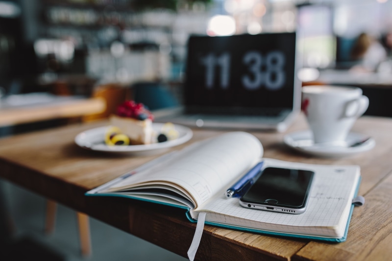cheese cake, laptop, restaurant, indoors, macbook, work, cheese, food and drink, desk, drink, cake, focus on foreground, technology, cafe, coffee shop