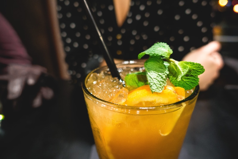 drinking Straw, hand, food, 5K, bar, leaf, household equipment, alcohol, garnish, cold temperature, Orange juice, drinking Glass, focus on foreground