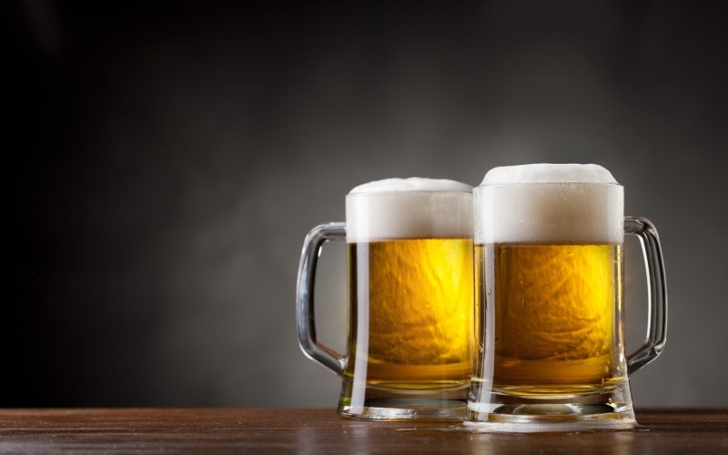refreshment, freshness, table, drink, pint glass, alcohol, no people, glass, cup, wood - material, beer, beer glass, frothy drink, drinking glass, black background