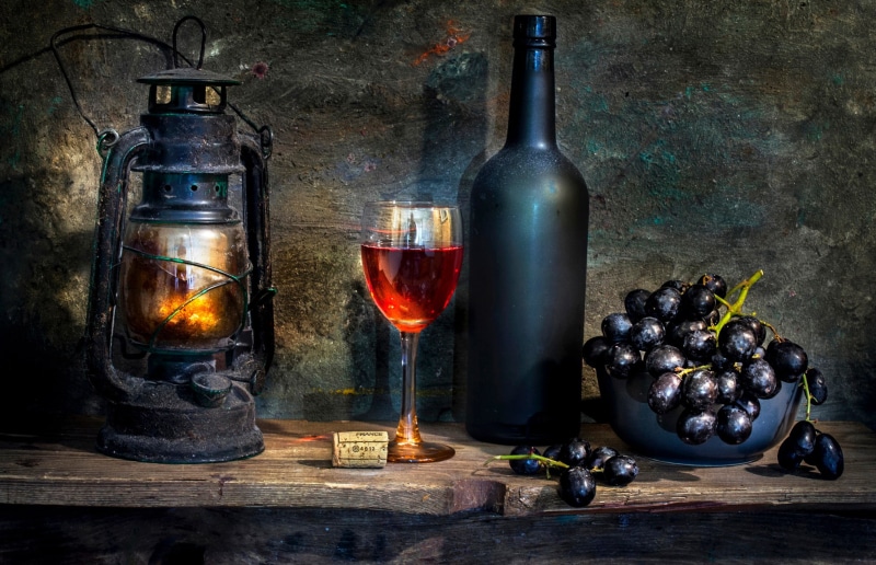table, food and drink, lantern, no people, lamp, painting, bottle, wine bottle, glass - material, glass, healthy eating, alcohol, container, refreshment