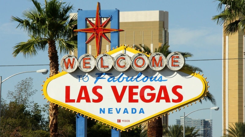 building exterior, western script, casino, welcome sign, welcome, travel destinations, nevada, shield, plant, sign, outdoors, no people, sky, architecture
