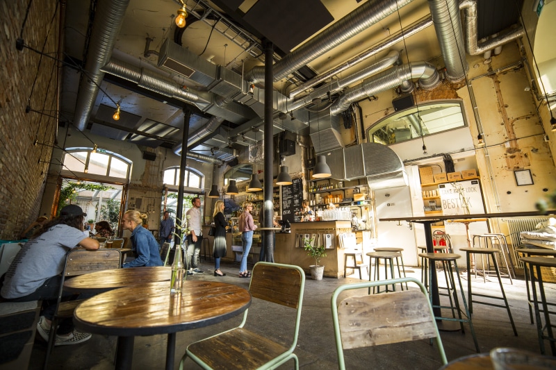 cafe, women, food and drink, man, standing, real people, food, table, front, coffee shop, group of people, indoors, cashier, men, sitting, business, woman