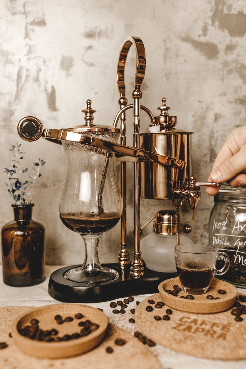 bottle, coffeemaker, food and drink, goblet, 5K, human, text, sink faucet, hand, holding, refreshment, glass, cafe, beverage, coffe shop, steel, zapra