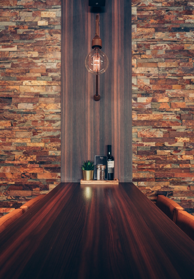 lighting equipment, brick wall, restaurant, meeting, brick, drinking, dining, electric lamp, wall - building feature, wine, alcohol, pendant light, talk